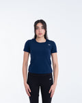 Woman wearing a navy blue t-shirt and black pants on a white background